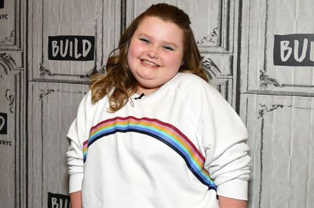 honey boo boo wearing a white sweatshirt smiling at the camera 